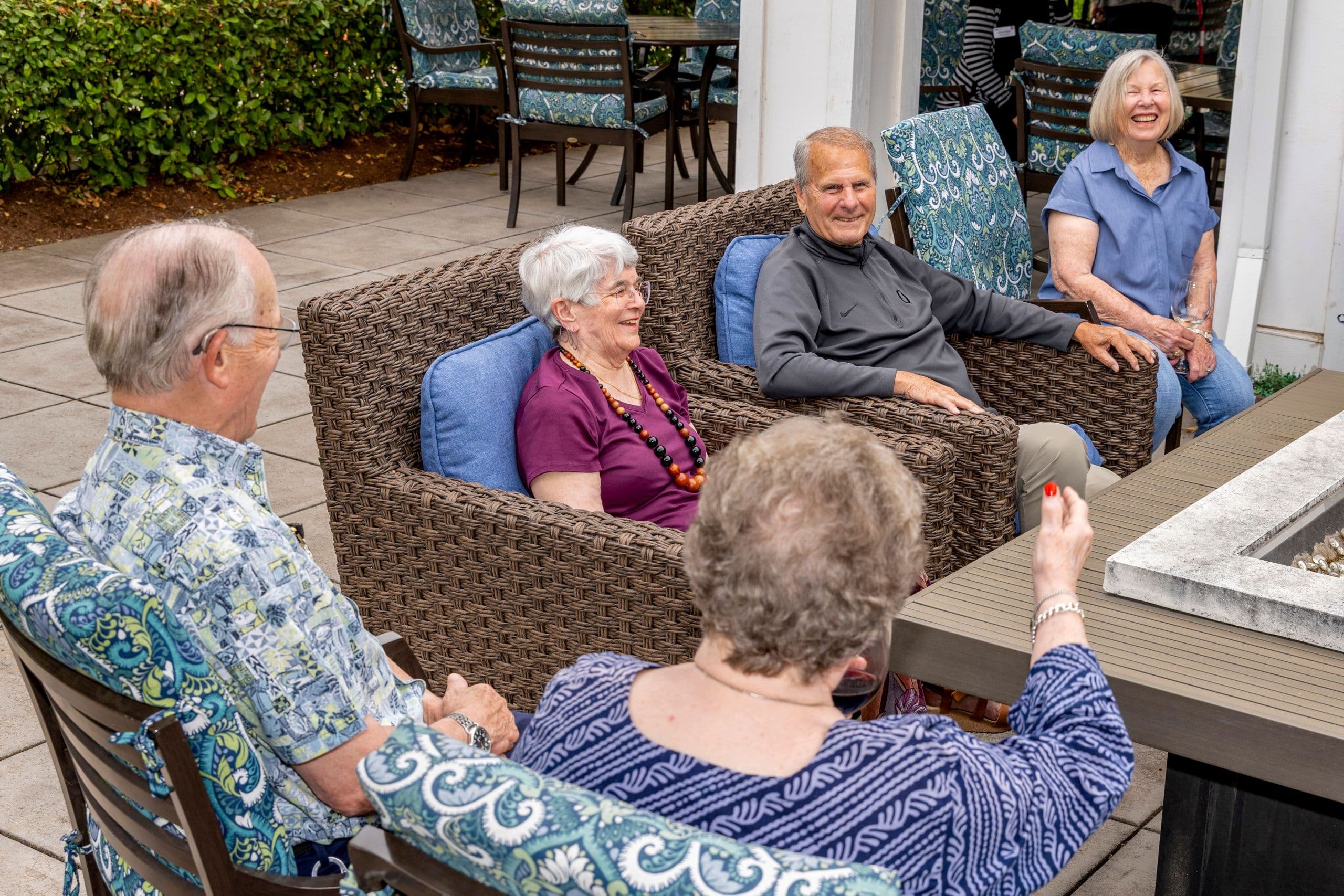 A group of residents sitting in the bistro courtyard